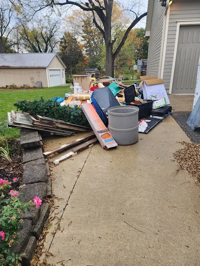 Dumpster being loaded with debris for Roofing Dumpster Rental in Keyport